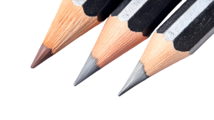 A close-up view of three colored pencils on a black background