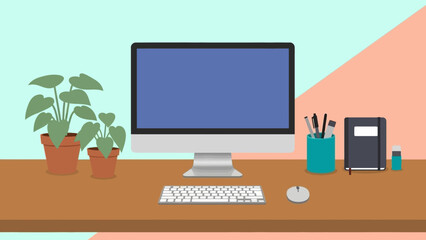 Modern office desk with computer and plants on wooden surface.