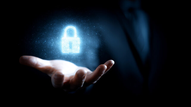 Glowing digital padlock hovering above an open hand illustrating cybersecurity protection data safety and secure systems.

