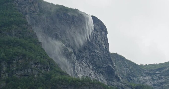 Powerful seven sisters waterfall cascading down cliff in norway