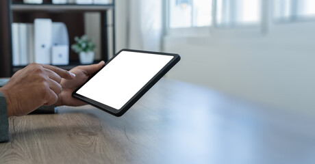 man using businessman holds a mockup holding blank screen tablet Mockup replaces your design mockup in the office