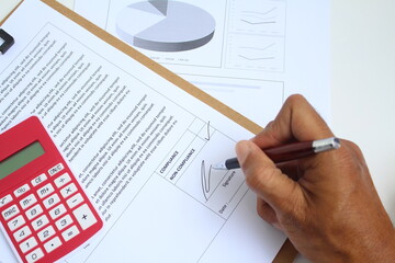 An auditor giving signature on a audit result either it is compliance or non compliance. Business...