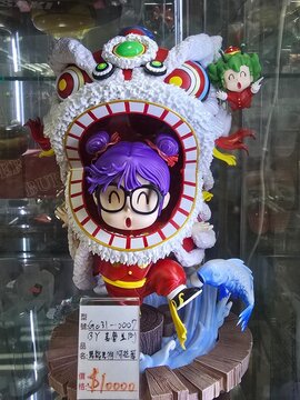 Taipei, Taiwan, December 15, 2025 &ndash; Arale Norimaki Character Figure Displayed in Model Shop Window