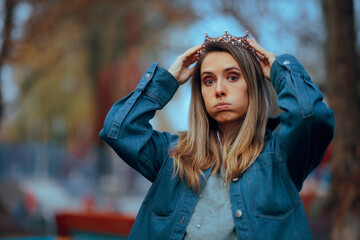 Woman Puts on a Crown Feeling Puzzled and in Doubt. Lady uncertain about her self worth building more confidence in herself 
