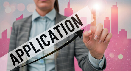 A woman submits an application on a touchscreen with a cityscape silhouette background. She is wearing a gray blazer, the modern concept for job applications.