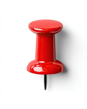 Glossy red thumbtack casts a subtle shadow on plain white background