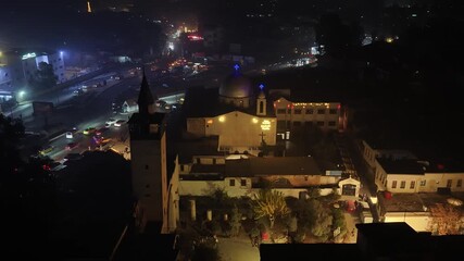 Aerial shot shows a church decorated with lights on New Year's Eve in Damascus.