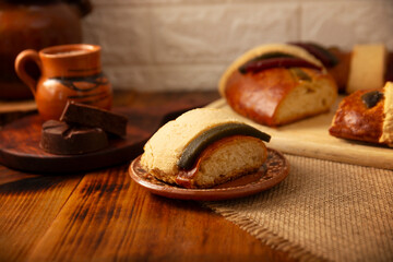 Rosca de Reyes, also called Three Kings Bread, Roscon, Epiphany Cake, traditionally served with hot chocolate in a clay Jarrito. Mexican tradition on January 5th.