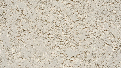 Close up of a beige textured surface with a rough porous appearance