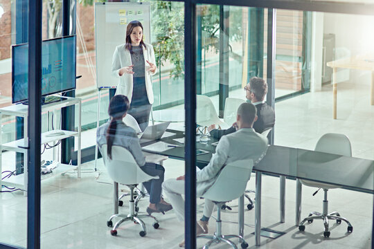 Presentation, speaker and planning with business woman in office for private equity, above and meeting. Investment banker, broker pitch and portfolio tracking with employees for feedback and proposal