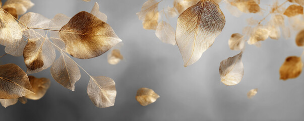 Abstract composition of golden skeletal leaves scattered over soft gray haze 32k ultra HD