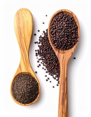 Wooden spoons holding spices, seeds, and powder