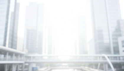 白色基調の背景画像　強いソフトフォーカスのイメージ画像　ぼやけた都会のビル街の風景　ビジネス用背景素材　強い背景ボケ