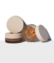 High-end makeup products with natural tones and sleek packaging