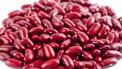 A close-up shot of a pile of vibrant, glossy, kidney-shaped beans, showcasing their rich, reddish-brown hue against a white backdrop