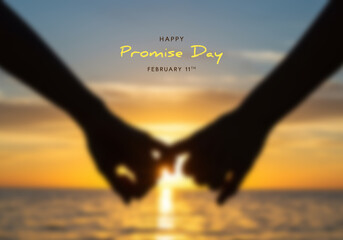 Silhouetted Couple Pinky Swearing Against Sunset Over Ocean on Promise Day hands