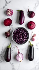 A close-up, overhead shot reveals a colorful assortment of fresh purple produce artfully arranged on a white marble surface