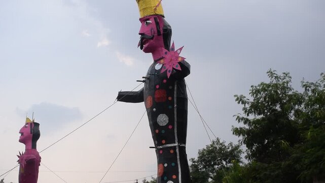 Ravnans being ignited during Dussehra festival at ramleela ground in Delhi, India, Big statue of Ravana to get fire during the Fair of Dussera to celebrate the victory of truth by Lord Rama