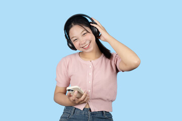 young teen girl happy smile enjoy music from phone, listening music by headphone studio isolated