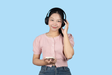 young teen girl happy smile enjoy music from phone, listening music by headphone studio isolated