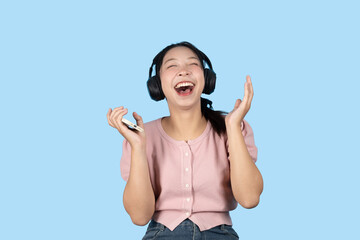 young teen girl happy smile enjoy music from phone, listening music by headphone studio isolated