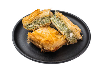 Borek pieces on dark plate, crispy phyllo pastry with spinach and cheese filling, sesame topping, moody food styling