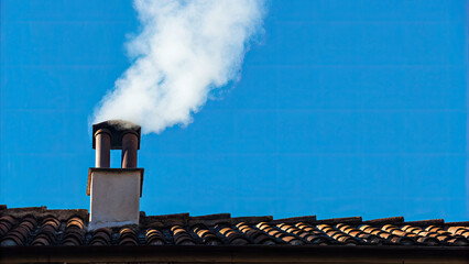 White smoke rises from the chimney concept. Chimney releasing smoke against a clear blue sky backdrop.