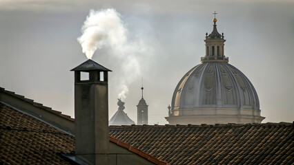 White smoke rises from the chimney concept. A misty view of rooftops with smoke rising behind a dome.