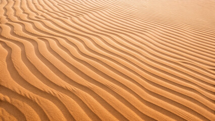 Top-down view of rippled desert sand concept. A serene view of undulating sand dunes in soft golden hues.