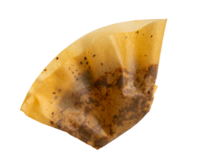 High-resolution photograph of coffee ground paper filter isolate on white, taken with a high-resolution 45MP camera