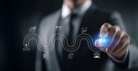 Business roadmap concept toward 2026 success, showing a professional businessman pointing at a digital target with futuristic interface icons symbolizing strategy, innovation, sustainability, teamwork