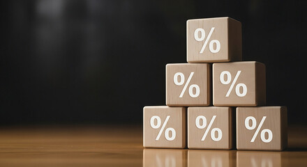 Stack of wooden blocks with percentage signs on them