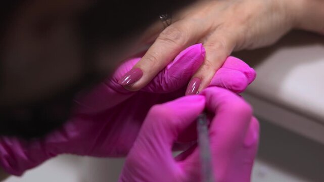 Close Up View Of Nail Border Refinement Showing Detailed Work With Delicate Lighting And Accessories Visible. Media