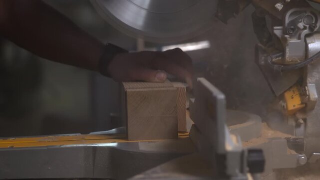 Woodcutting Saw Motion, Detailed View Of Worker Operating Miter Saw To Cut Timber In Workshop Environment. Media