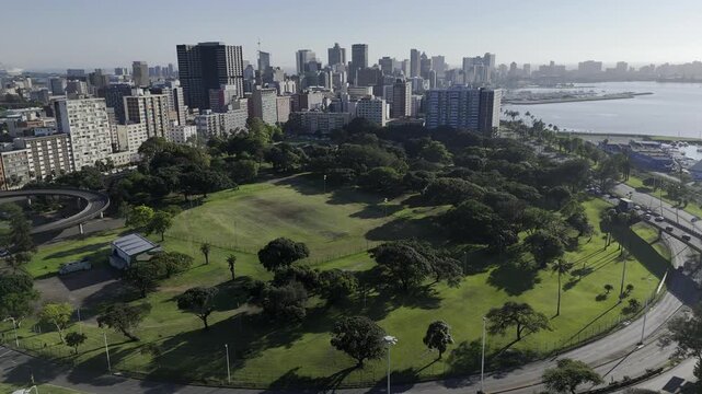 Drone orbits to the left around westside of Albert Park in the early morning on the southeast side of downtown Durban, South Africa