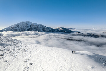 Above the clouds on mountain peak, Northern Grigna, Valsassina, Italy landscape