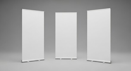 Three blank white rollup banners standing upright, ready for custom branding or advertising, against a neutral grey background for mockup