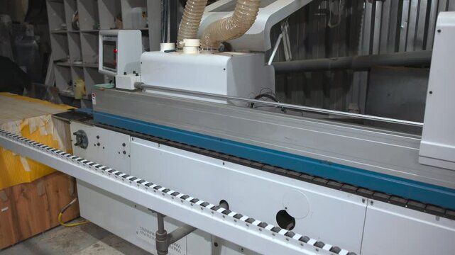 Workshop Scene Featuring Detailed View Of Edge Bander With Operator And Auxiliary Components. Media