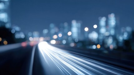 Close-up of a city skyline at night. the sky is dark blue and the buildings are lit up with colorful lights, creating a bokeh effect.