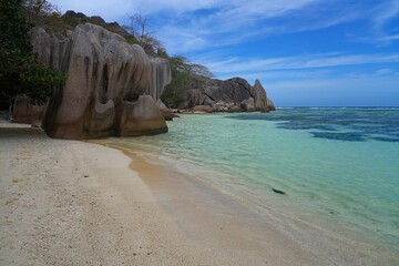 Day view of the Anse Source d Argent beach with its granite boulders on La Digue island in the Seychelles, one of the most beautiful beaches in the world