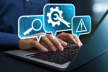 Online IT customer support. Remote help desk chat for technical support. Businessman using laptop computer to provide troubleshooting support.