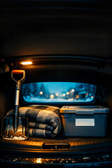 Winter emergency car kit with shovel blanket and storage box in trunk