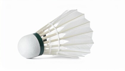 A white badminton shuttlecock with a feathered skirt and green-banded cork base rests in close-up—evoking aerodynamic elegance, sport precision, and minimalist focus in a clean visual study.
