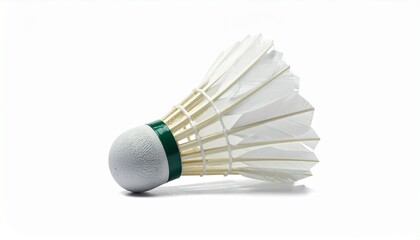 A white badminton shuttlecock with a feathered skirt and green-banded cork base rests in close-up&mdash;evoking aerodynamic elegance, sport precision, and minimalist focus in a clean visual study.