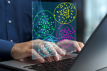 Data clustering chart and cluster analysis. Machine learning and data segmentation. Data scientist using laptop computer to analyze big data.