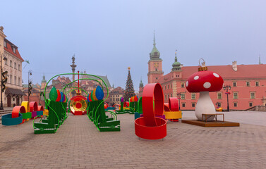 Colorful Christmas decorations and Sigismund column in historic square in Warsaw Poland during winter