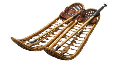 Snowshoes and poles side by side natural angled composition on transparent background