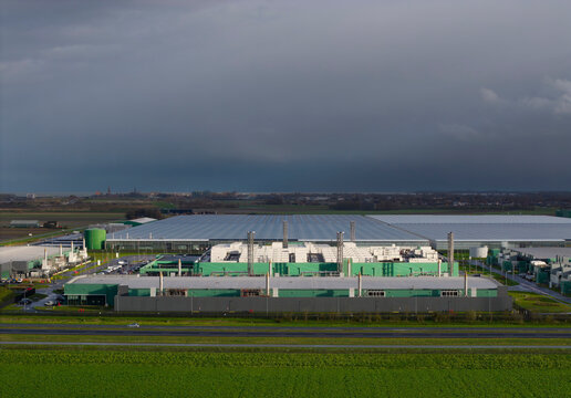 Modern data center exterior under dark clouds in Middelmeer, The Netherlands