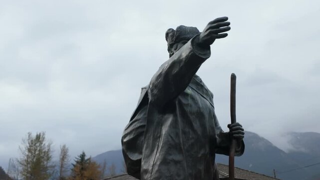 Gimbal close-up panning shot of the Skagway Centennial monument commemorating the native Tlingit guides during the Klondike Gold Rush in Southeast Alaska. 4K