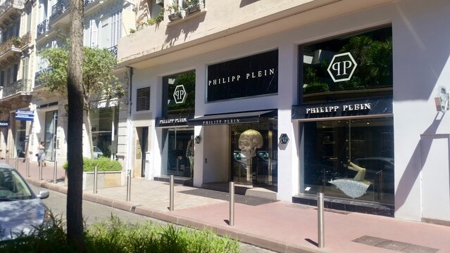 July 24.2017. Cannes. France. The high-end Philipp Plein storefront on the prestigious streets of Cannes. This shot captures the brand's bold aesthetic, featuring its iconic crystal skull mascot.